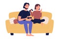 Young family couple sitting on sofa playing on TV gaming console video games in living room isolated