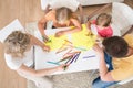 Young family drawing together with kids