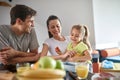 A young couple playing while having a breakfast at home. Love, together, breakfast, home Royalty Free Stock Photo