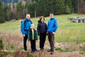 Young family enjoying their holidays in a national park. Caucasian family walking down a mountain trail and having fun Royalty Free Stock Photo