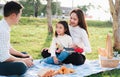 Young family father, mother and children having fun and enjoying outdoor together Royalty Free Stock Photo