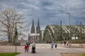 Young family, father, mother kids in front of the iconic hohenzollern bridge, or hohenzollernbrucke,