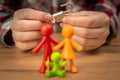 Young family first problems, colorful figurines on table with padlock. Conflict, crisis concept photo