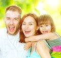Young family having fun outdoors Royalty Free Stock Photo