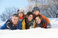 Young Family Having Fun In Snowy Landscape
