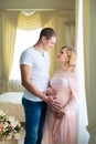 Young family. Husband gently hugging his pregnant wife. Royalty Free Stock Photo