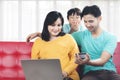 Young family of husband, pregnant wife and toddler shopping online Royalty Free Stock Photo