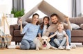 Happy family with dog enjoying new home Royalty Free Stock Photo