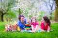 Young family with kids having picnic outdoors Royalty Free Stock Photo