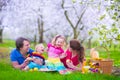 Young family with kids having picnic outdoors Royalty Free Stock Photo