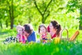 Young family with kids having picnic outdoors Royalty Free Stock Photo
