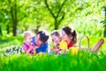 Young family with kids having picnic outdoors Royalty Free Stock Photo