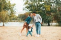 A young family with a little baby having a nice time together in the park Royalty Free Stock Photo