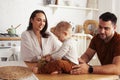 young family with little cute son on kitchen in morning happy smiling, lifestyle people concept Royalty Free Stock Photo