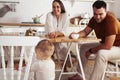 young family with little cute son on kitchen in morning happy smiling, lifestyle people concept Royalty Free Stock Photo