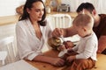 young family with little cute son on kitchen in morning happy smiling, lifestyle people concept Royalty Free Stock Photo