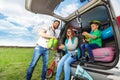 Young family loading luggage boot for the car trip Royalty Free Stock Photo