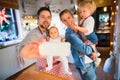 Young family making cookies at home. Royalty Free Stock Photo