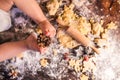 Young family making gingerbread cookies at home. Royalty Free Stock Photo