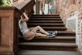 Young family. Parents sit with their son on the stairs. Mom and dad and your baby. Little boy. Royalty Free Stock Photo