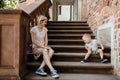 Young family. Parents sit with their son on the stairs. Mom and dad and your baby. Little boy. Royalty Free Stock Photo