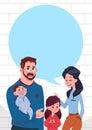 Young Family Parents With Two Kids Chat Bubble Copy Space, Daughter And Son Standing Over White Brick Wall Background Royalty Free Stock Photo