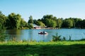 Young family pedal boating in the leisure and recreation park