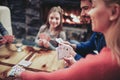 Young family playing card game Royalty Free Stock Photo