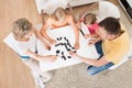 Young Family Playing Domino Game Royalty Free Stock Photo