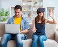 Young family playing games with virtual reality glasses Royalty Free Stock Photo