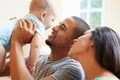 Young Family Playing With Happy Baby Son At Home Royalty Free Stock Photo