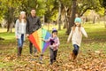 Young family playing with a kite Royalty Free Stock Photo