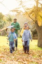 Young family playing with a kite Royalty Free Stock Photo