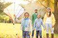 Young family playing with a kite Royalty Free Stock Photo