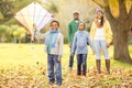 Young family playing with a kite Royalty Free Stock Photo