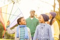 Young family playing with a kite Royalty Free Stock Photo