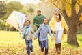 Young family playing with a kite Royalty Free Stock Photo