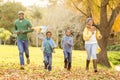 Young family playing with a kite Royalty Free Stock Photo