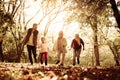 Young family playing in park and running together. Royalty Free Stock Photo