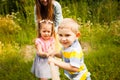 Young family playing tug of war on nature Royalty Free Stock Photo