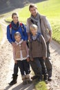 Young family posing in park