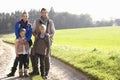 Young family posing in park