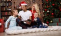 Young family reading child`s book