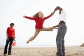 Young Family Relaxing On Beach Camping Holiday Royalty Free Stock Photo