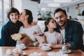 Young Family is Resting in Cafe Royalty Free Stock Photo