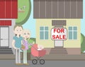 Young family with for sale house. Royalty Free Stock Photo