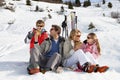 Young Family Sharing A Picnic On Ski Vacation