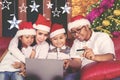 Young family shopping online at Christmas time Royalty Free Stock Photo