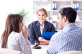 The young family signing marriage documents at laywers office Royalty Free Stock Photo