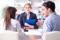 The young family signing marriage documents at laywers office Royalty Free Stock Photo